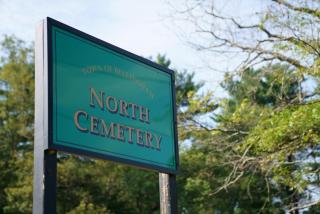 North Cemetery sign with trees in the background