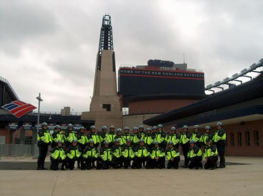 Officer Melanson (Front row, 4th from the right) With MOP unit during a training session at Gillette Stadium in Foxboro.