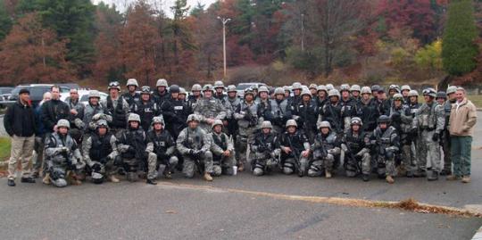 SWAT team during a recent training session. Officer Kutcher is pictured kneeling (Front Row 5th from the right)